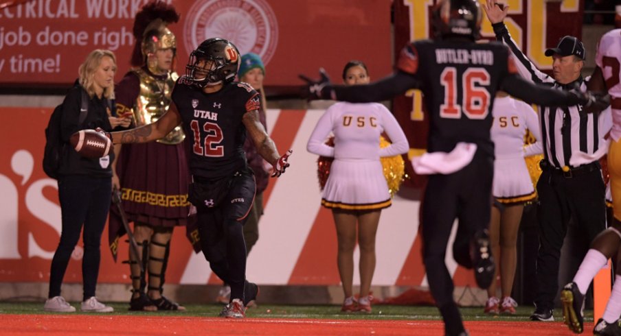 Sep 23, 2016; Salt Lake City, UT, USA; Utah Utes wide receiver Tim Patrick (12) celebrates with wide receiver Cory Butler-Byrd (16) after catching an 18-yard touchdown pass with 16 seconds left for the winnning score against the USC Trojans during a NCAA football at Rice-Eccles Stadium. Utah defeated USC 31-27. Mandatory Credit: Kirby Lee-USA TODAY Sports