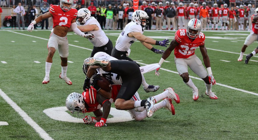 Eric Glover-Williams makes a tackle against Northwestern.
