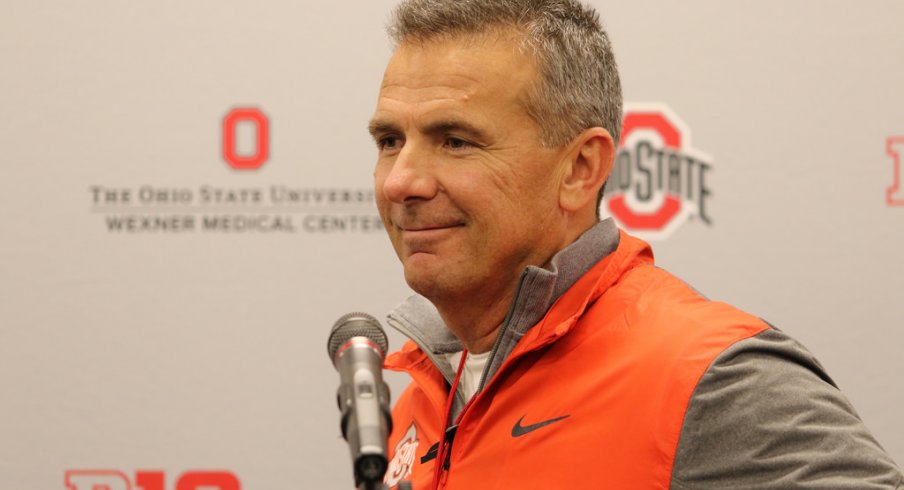 Urban Meyer flashes a smile at a press conference. 