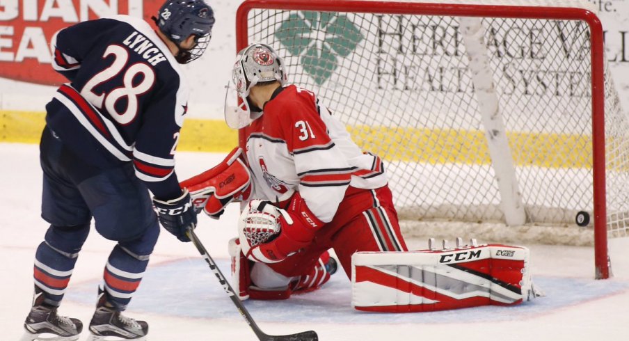 Robert Morris' Luke Lynch scores against Ohio State goalie Matt Tomkins.