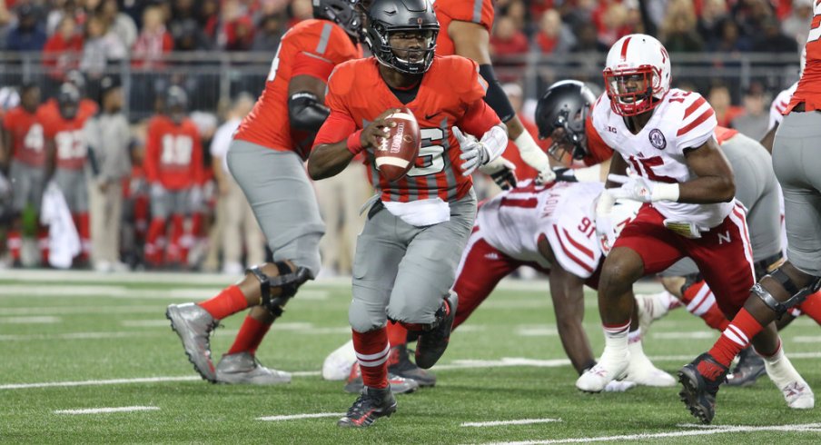 J.T. Barrett scrambles and keeps his eyes downfield against Nebraska. 