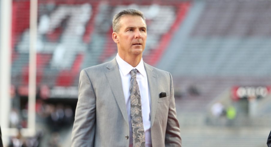 Urban Meyer walks into Ohio Stadium prior to the game against Nebraska. 