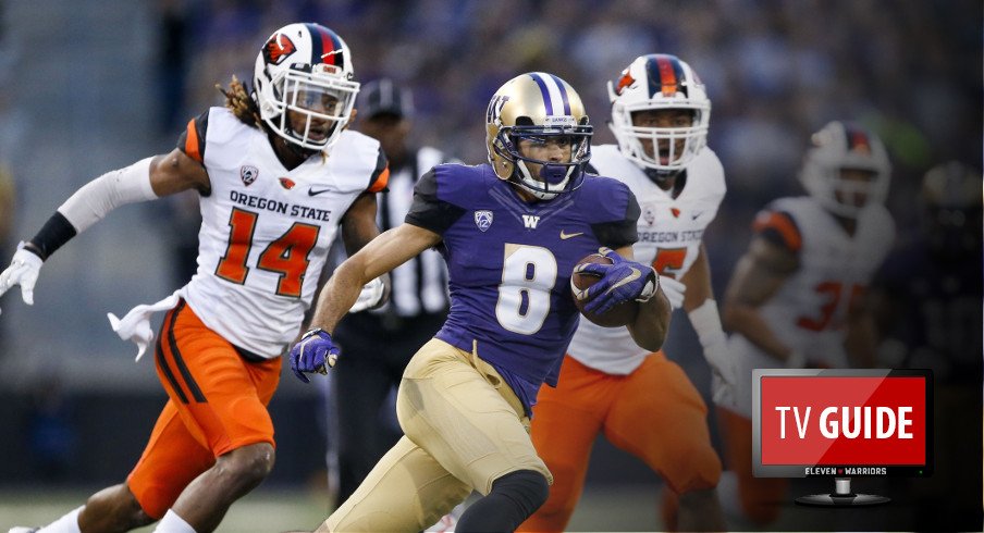 Oct 22, 2016; Seattle, WA, USA; Washington Huskies wide receiver Dante Pettis (8) picks up yards after the catch against the Oregon State Beavers during the third quarter at Husky Stadium. Pettis had 112 yards and two touchdowns and Washington won 41-17. Mandatory Credit: Jennifer Buchanan-USA TODAY Sports