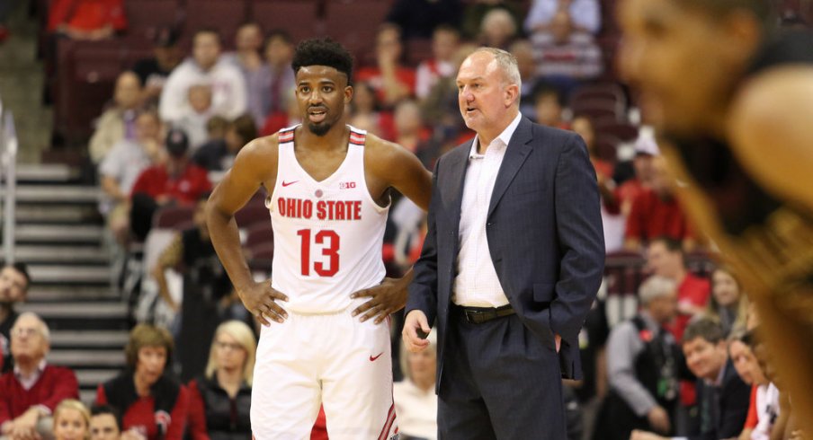 Thad Matta talks with Ohio State point guard JaQuan Lyle. 