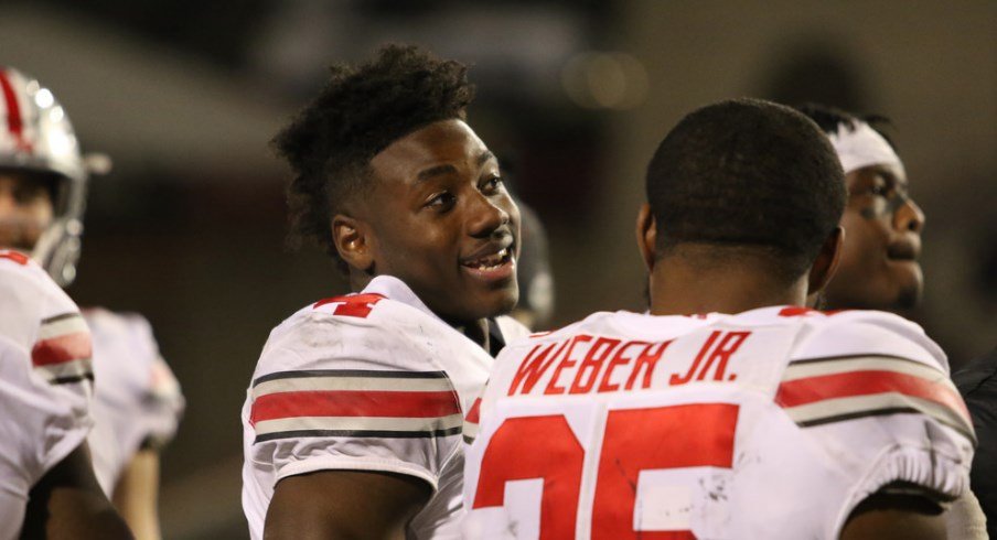 Curtis Samuel chats with Mike Weber during the game against Maryland.