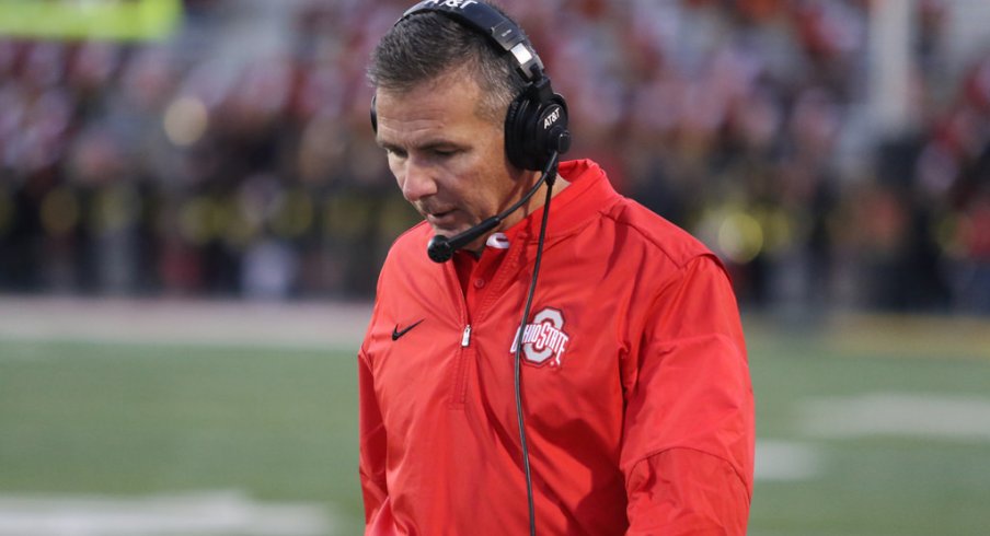 Urban Meyer strolls the sidelines at Maryland. 