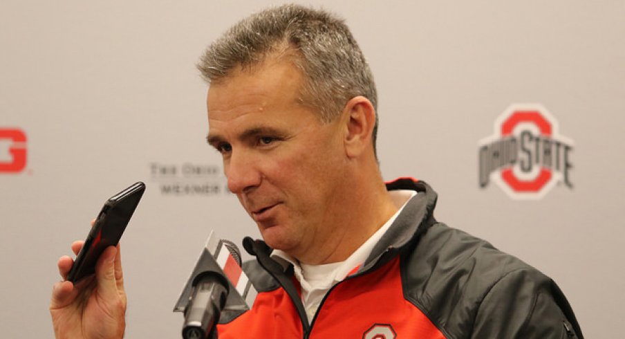 Urban Meyer talks about his wife calling him.