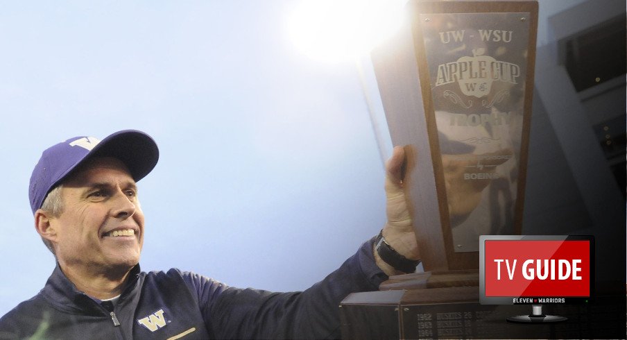 Nov 25, 2016; Pullman, WA, USA; Washington Huskies head coach Chris Petersen hands off the the Apple Cup Trophy after a game against the Washington State Cougars after a game at Martin Stadium. The Huskies won 45-17. Mandatory Credit: James Snook-USA TODAY Sports