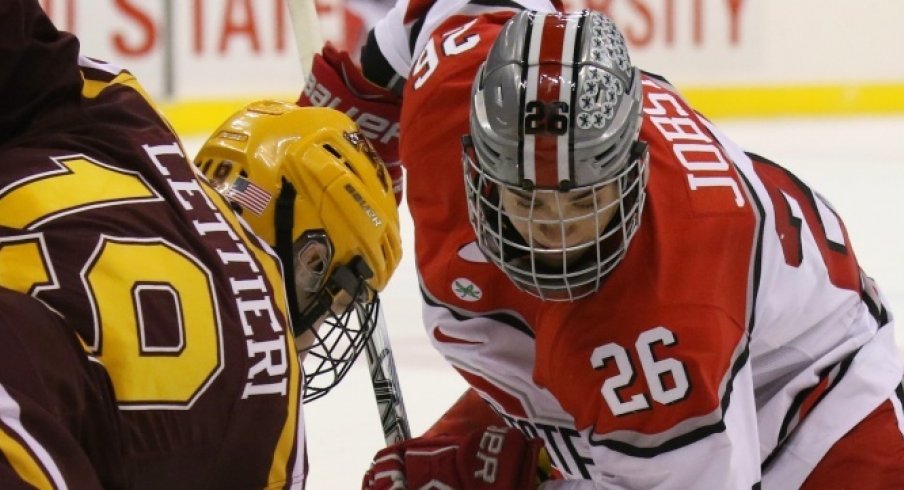 Ohio State's Mason Jobst faces off against Minnesota's Vinni Lettieri.