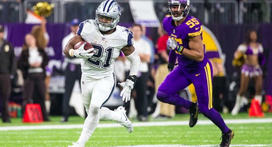 Ezekiel Elliott runs against the Minnesota Vikings.