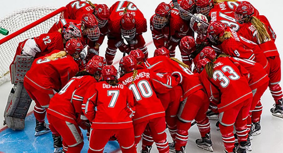 The Ohio State women's hockey Buckeyes huddle up during warm-ups. 