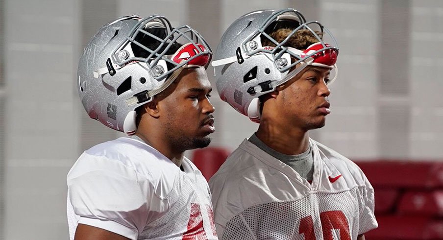Brendon White, right, participates in his first practice at Ohio State