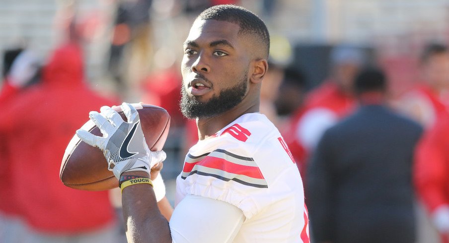 Ohio State quarterback J.T. Barrett warms up for a game earlier this season. 