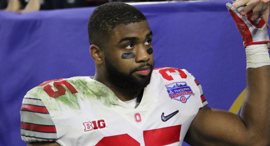 Ohio State LB Chris Worley shakes hands with fans after loss to Clemson. 