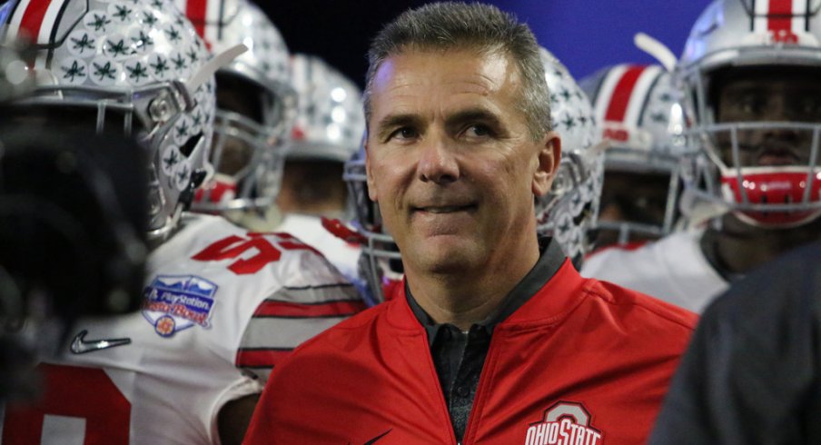 Urban Meyer prepares to lead his team on the field for the Fiesta Bowl. 