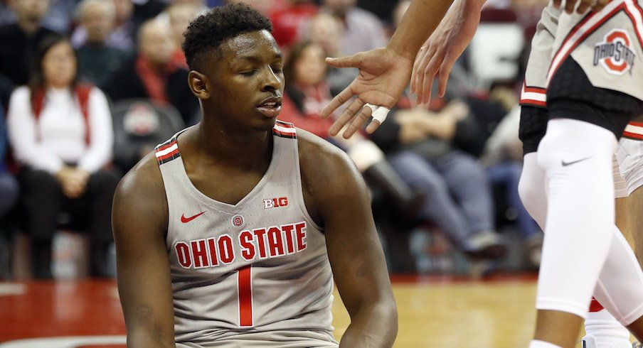 Ohio State's Jae'Sean Tate sits on the floor against Purdue. 