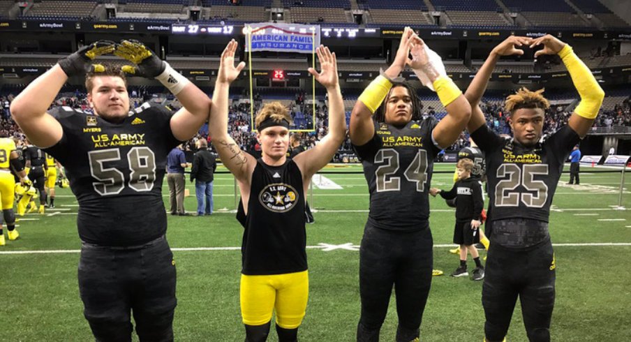 Josh Myers, Tate Martell, Chase Young and Shaun Wade spell out O-H-I-O