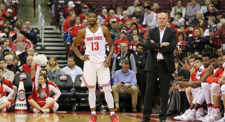 JaQuan Lyle and Thad Matta stand in front of Ohio State's bench earlier this season.
