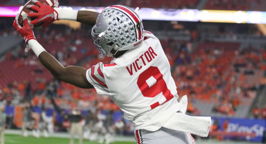 Binjimen Victor warms up before the Fiesta Bowl