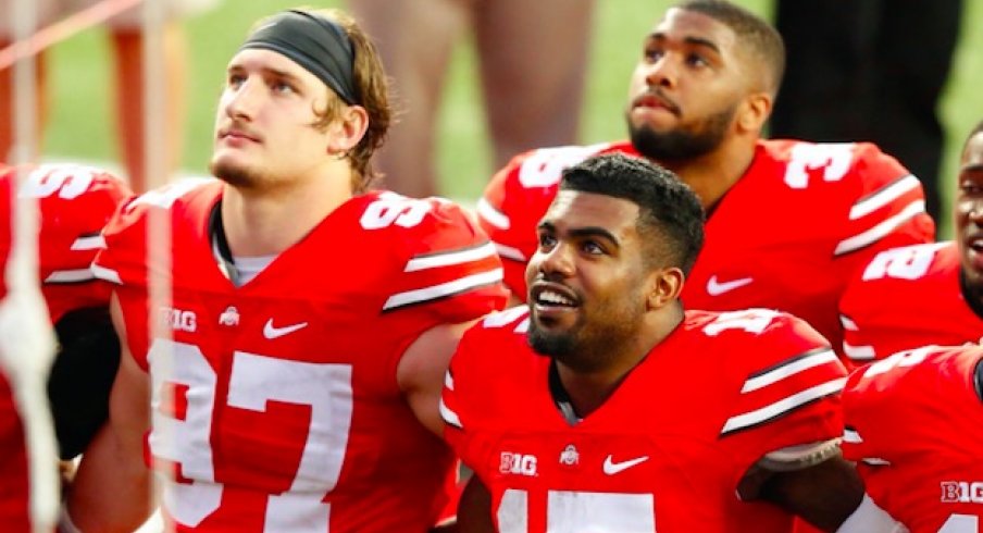 Ezekiel Elliott and Joey Bosa, former Ohio State teammates, named PFWA Rookies of the Year.