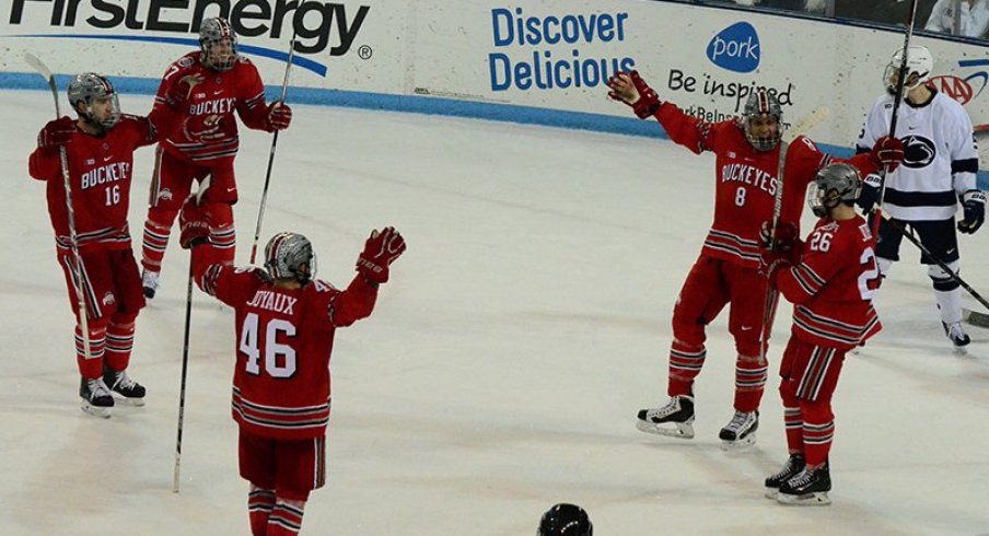 Ohio State men's hockey celebrates in a shootout win over Penn State.