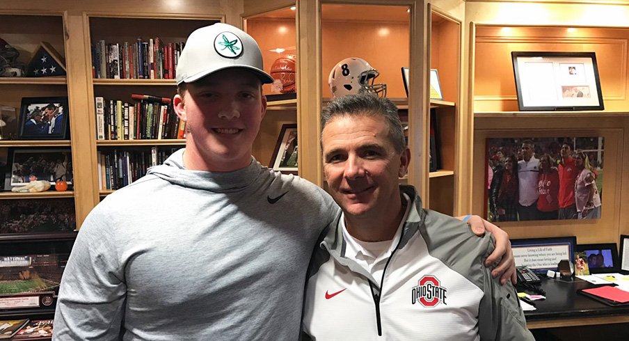 Minneapolis Edna Senior sophomore offensive tackle Quinn Carroll with Urban Meyer in the coach's office.