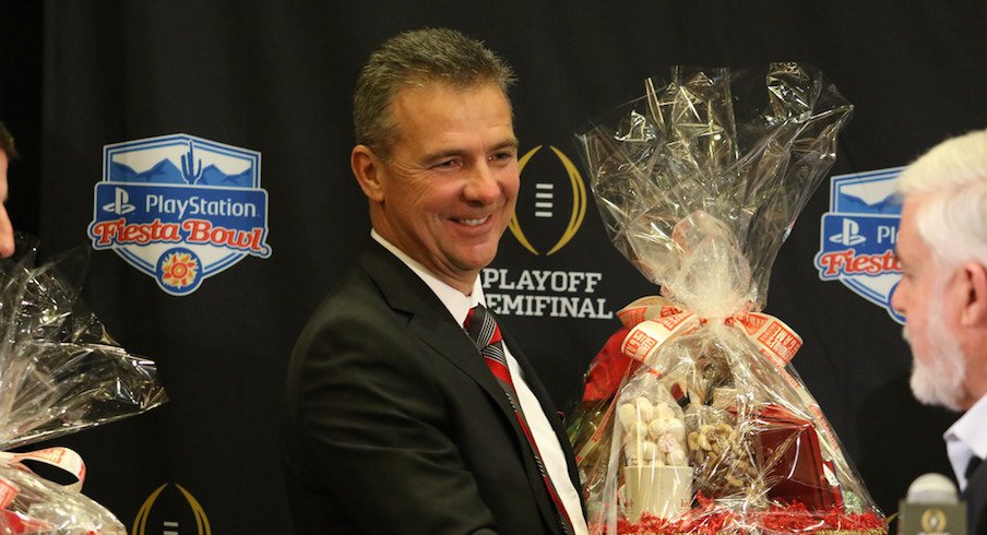 Urban Meyer receives $160,000 retention bonus, sees buyout in contract drop nearly $6.1 million on Wednesday.