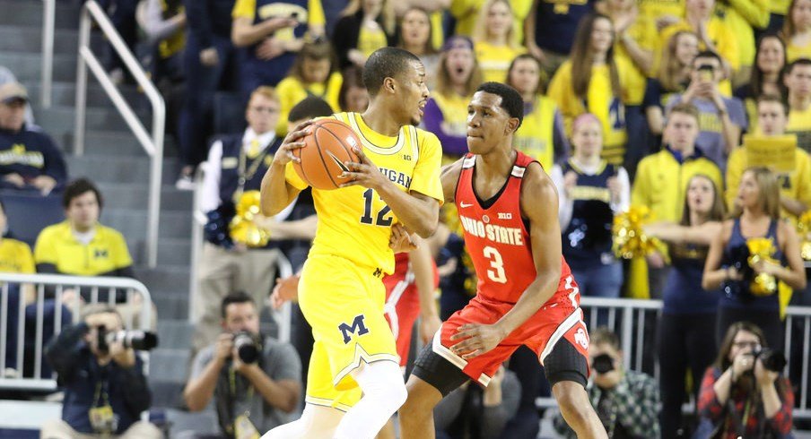 C.J. Jackson guards a Michigan player in the game on Saturday.