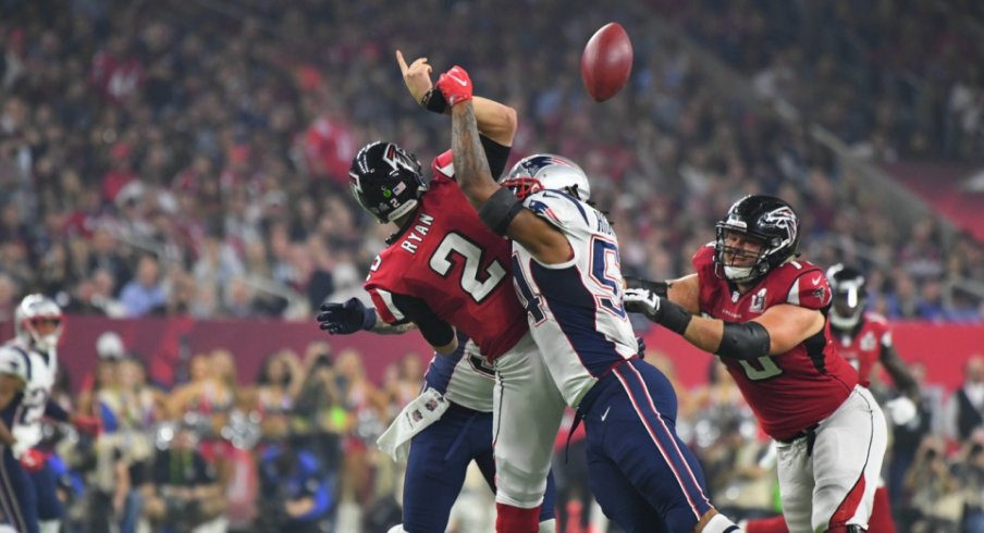 Atlanta QB Matt Ryan is hit while throwing during Super Bowl LI against New England