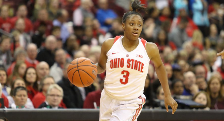 Kelsey Mitchell takes the ball up the court.