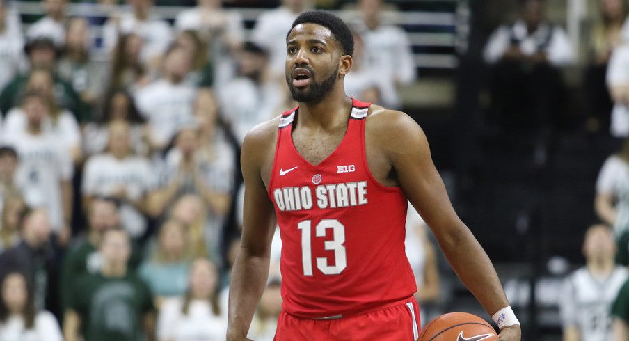 Ohio State point guard JaQuan Lyle holds the ball at Michigan State. 