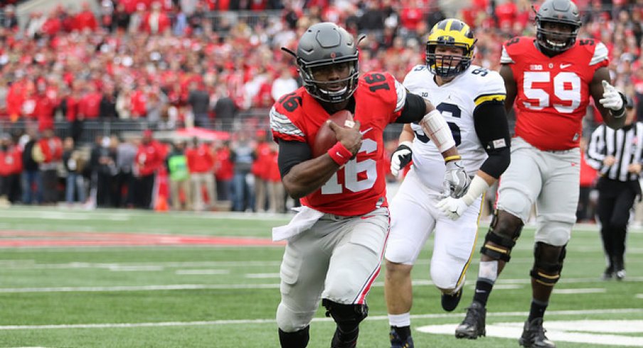 Ohio State quarterback J.T. Barrett scores against Michigan.