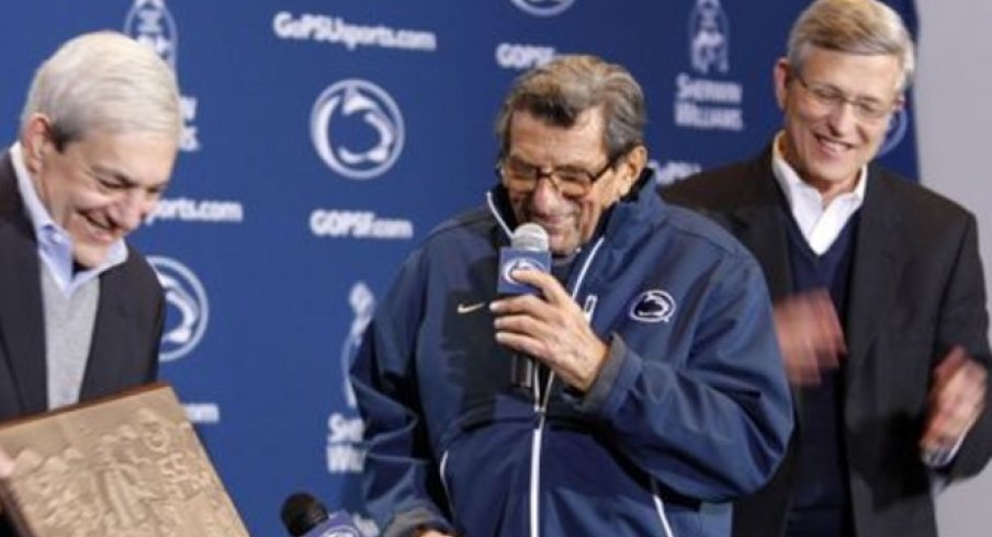 October 29, 2011; University Park, PA, USA; Penn State university president Graham Spanier (left) presents Penn State Nittany Lions head coach Joe Paterno (middle) with a plaque honoring his 409th career victory as athletic director Tim Curley (right) looks on after the game against the Illinois Fighting Illini at Beaver STadium. Penn State defeated Illinois 10-7. Mandatory Credit: Rob Christy-USA TODAY Sports