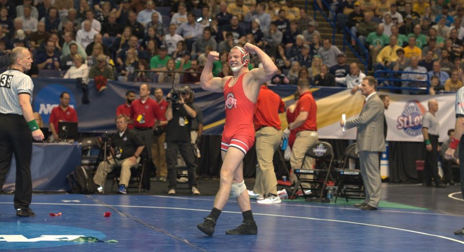 Bo Jordan flexes after a semifinals win over Cornell's Brian Realbuto.