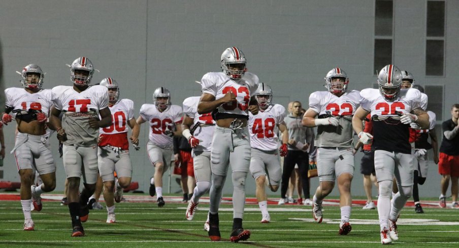 Ohio State's defense warms up prior to Tuesday's practice. 