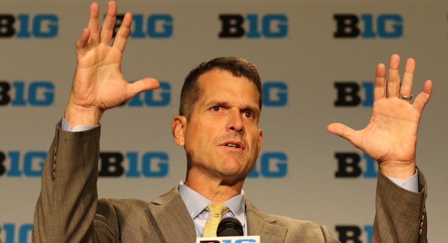 Jim Harbaugh delivers a press conference