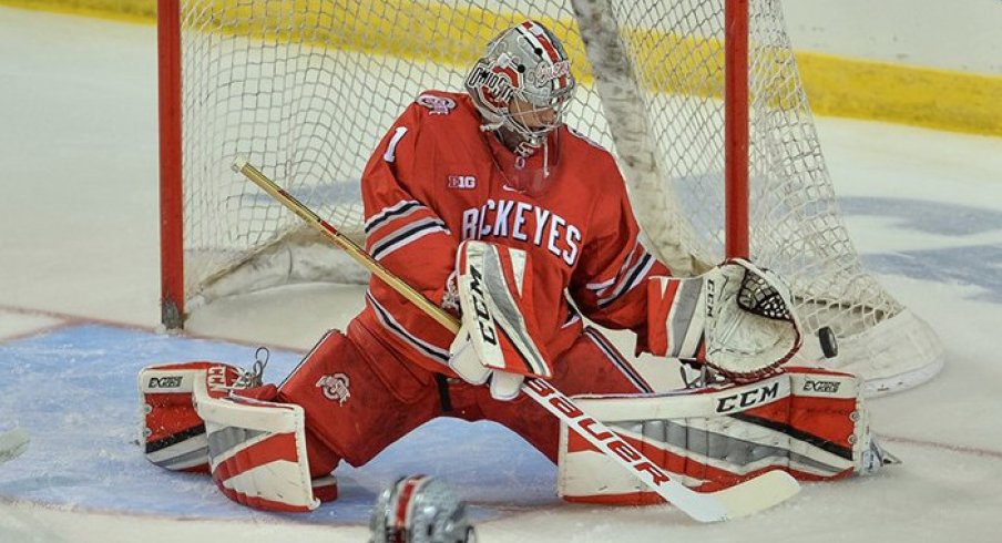 Matt Tomkins makes a save in the Buckeyes' NCAA opener against Minnesota-Duluth.