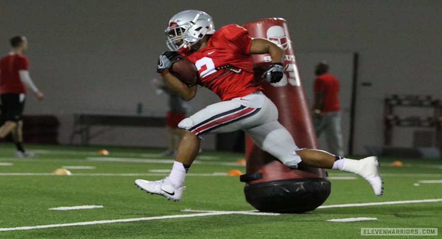 J.K. Dobbins passes Antonio Williams.