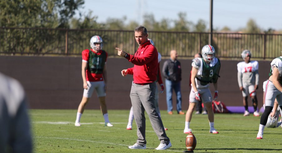 Urban Meyer coaches up his team during spring practices