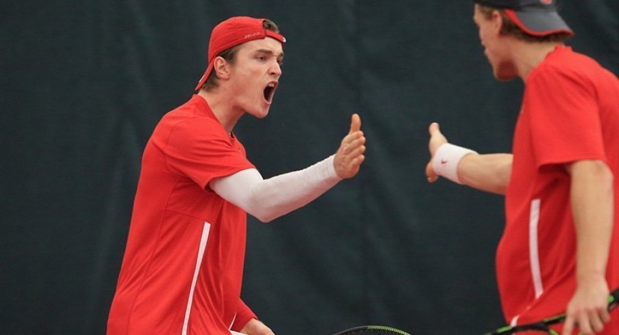 Mikael Torpegaard and Herkko Pollanen celebrate after a doubles win.