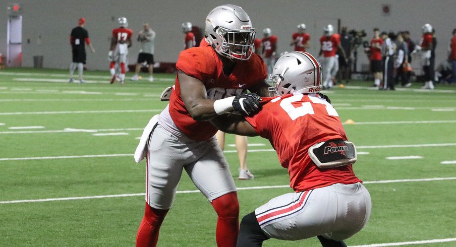 Ohio State tight ends A.J. Alexander and Kierre Hawkins work during a recent spring practice.