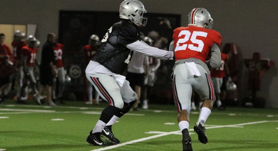 J.T. Barrett hands off to Mike Weber during spring practice. 