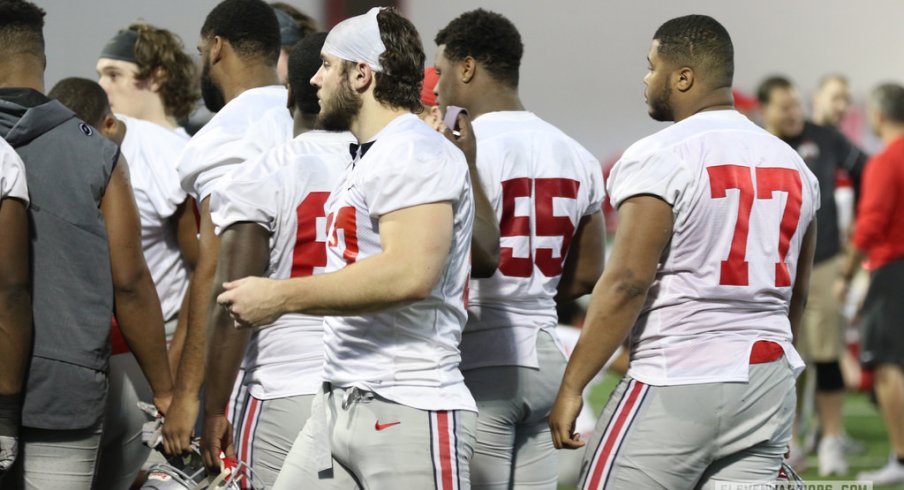 Ohio State's defensive line gathers during a spring practice.