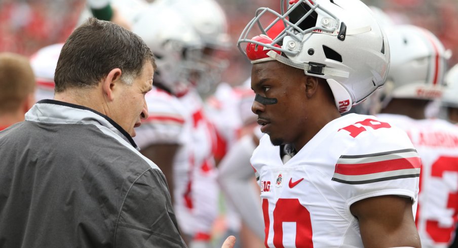 Ohio State safeties coach talks to Kendall Sheffield at the spring game. 