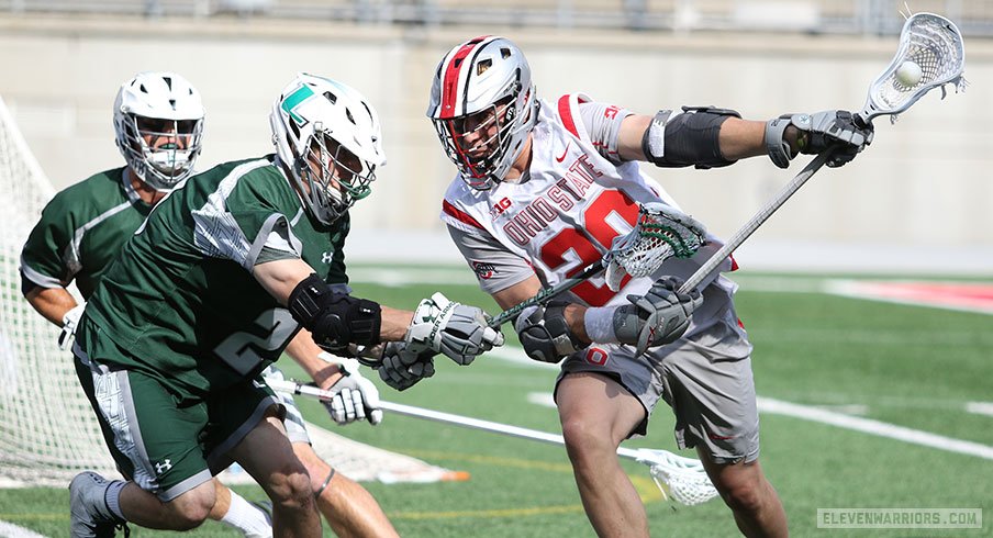 Ohio State's Eric Fannell moves against Loyola defenders in an NCAA Championship lacrosse game. 
