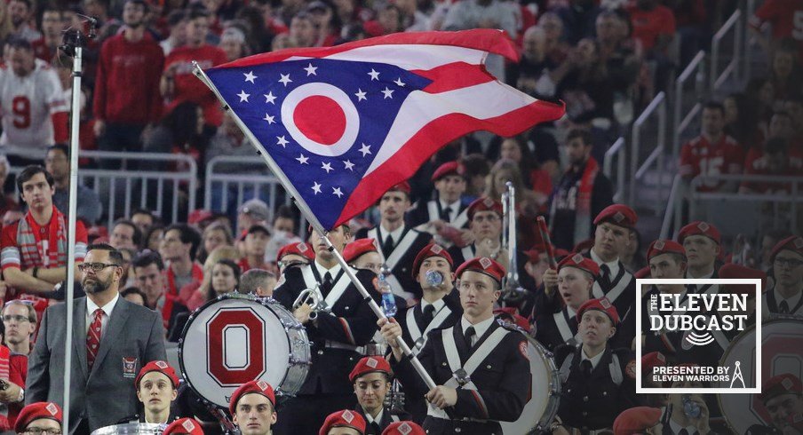 An Ohio State band member waves the Ohio state flag