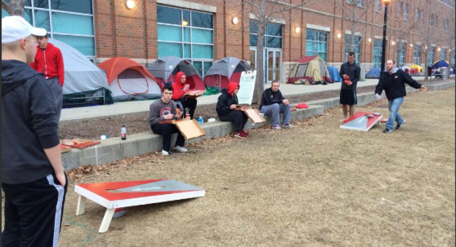 Students playing cornhole in Mattaritaville