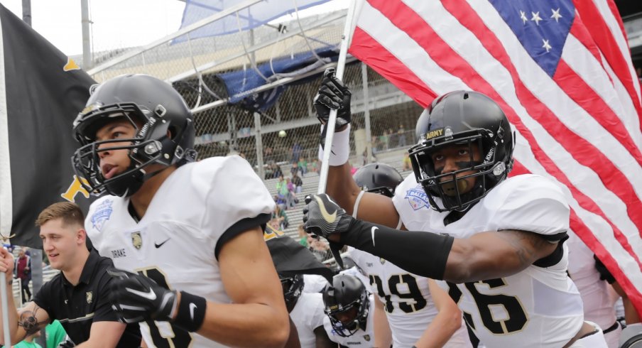 Dec 27, 2016; Dallas, TX, USA; Army Black Knights running back Christian Drake (8) and Black Knights running back Donovan Franklin lead the Army Black Knights onto the field against North Texas Mean Green in the Heart of Dallas Bowl at Cotton Bowl Stadium. Mandatory Credit: Sean Pokorny-USA TODAY Sports