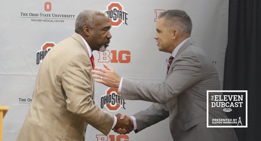 Ohio State athletic director Gene Smith shakes hands with men's basketball head coach Chris Holtmann