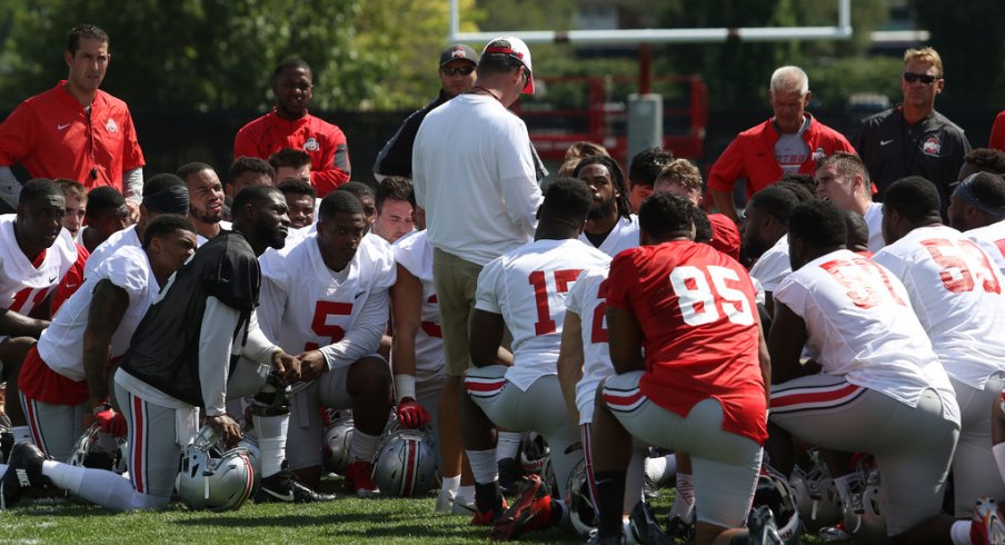 Urban Meyer addresses his team during fall camp last season. 